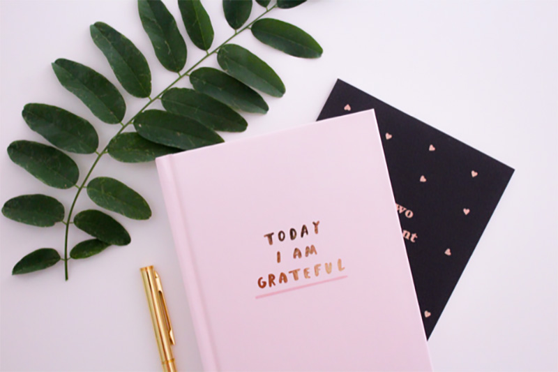Pink diary with "Today I am Grateful" printed on the cover